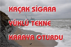 KAÇAK SİGARA YÜKLÜ TEKNE KARAYA OTURDU